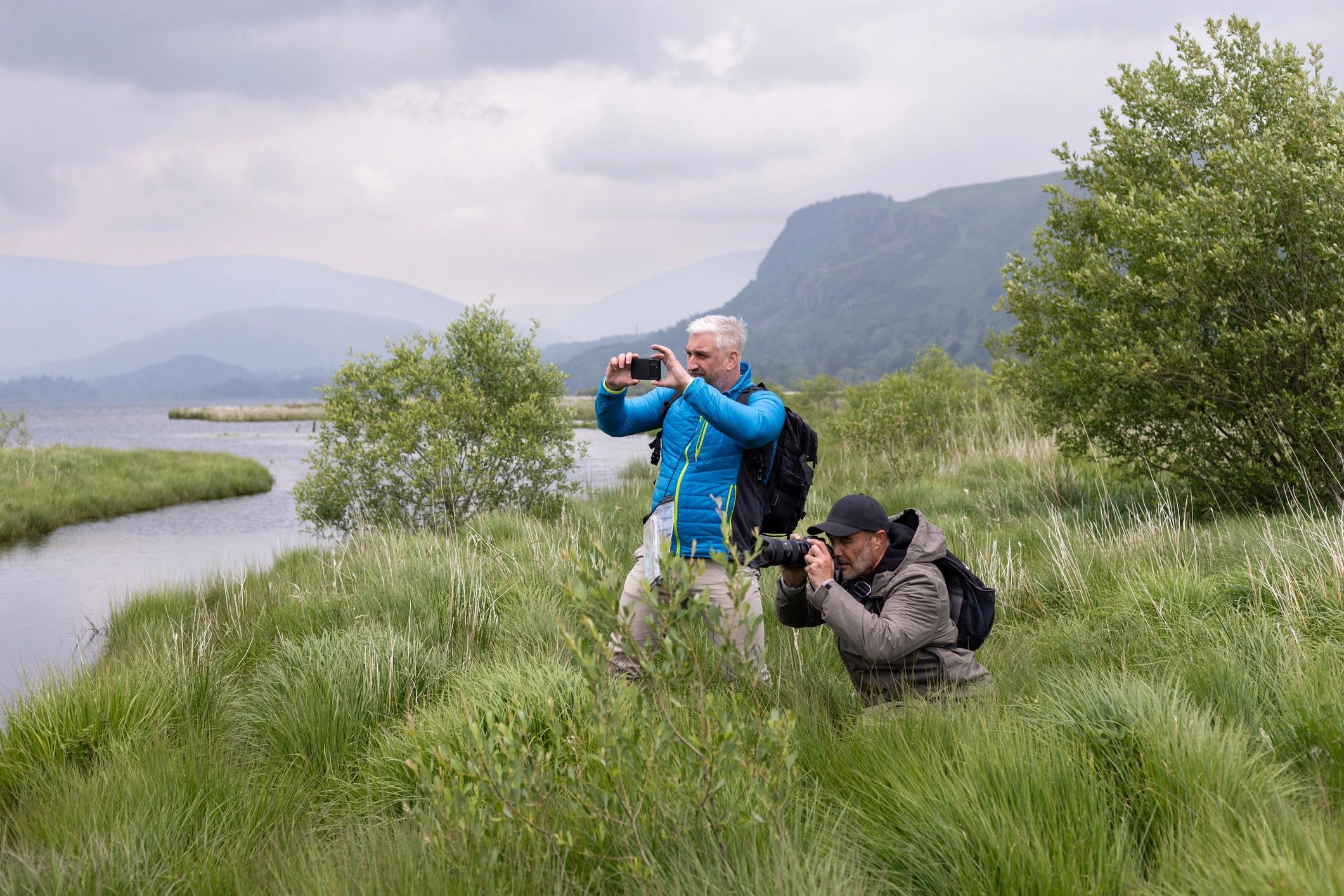 Photographer working with a client outdoors
