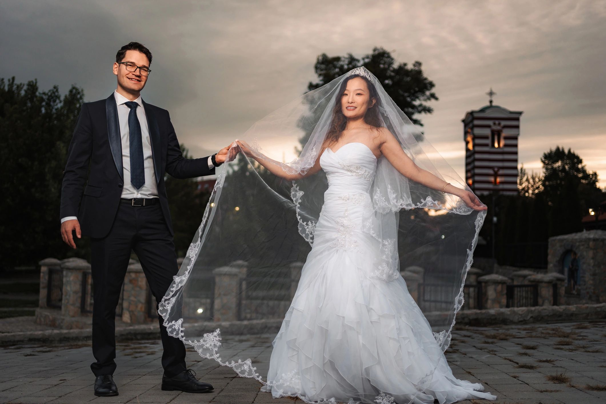 Newlywed couple portrait at sunset
